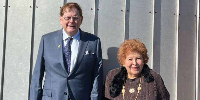 Dr. Austin & Mrs. Gloria Gulliver in front of the dome atop the McMaster building