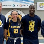 BU Athletics Director Russ Paddock and BU President David Docherty with members of the BU Bobcats, Faith Clearsky and Silas Owusu-Acheaw