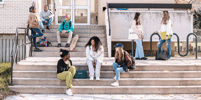 Students mingle on steps of Education building
